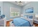 Staged bedroom with hardwood floors, ceiling fan, and lots of natural light at 441 Crumbley Rd, Mcdonough, GA 30252