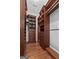 Walk-in closet with wood shelving and drawers for optimal organization at 441 Crumbley Rd, Mcdonough, GA 30252