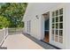 Deck view featuring white railings and french doors leading to bonus room at 441 Crumbley Rd, Mcdonough, GA 30252