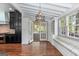 Bright dining room with hardwood floors, a beamed ceiling, and a view of the kitchen at 441 Crumbley Rd, Mcdonough, GA 30252