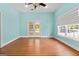 Bright, versatile room with hardwood floors, french doors, and a ceiling fan at 441 Crumbley Rd, Mcdonough, GA 30252