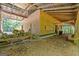 Open exterior features wood pile, table and forest trees at 441 Crumbley Rd, Mcdonough, GA 30252