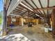 Spacious garage interior with concrete floor and many large work tables at 441 Crumbley Rd, Mcdonough, GA 30252