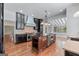 Spacious kitchen with dark cabinets, a large island, and stainless steel appliances, perfect for entertaining at 441 Crumbley Rd, Mcdonough, GA 30252