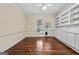 Bright living room featuring built in shelves and hardwood floors at 441 Crumbley Rd, Mcdonough, GA 30252