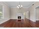 Bright living room featuring a fireplace, hardwood floors, and ample space for entertaining at 441 Crumbley Rd, Mcdonough, GA 30252