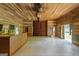 Open living room with wood paneling and natural light, showcasing the interior space at 441 Crumbley Rd, Mcdonough, GA 30252