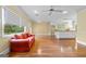 Open-plan living room connecting to the kitchen has gleaming hardwood floors and recessed lighting at 441 Crumbley Rd, Mcdonough, GA 30252