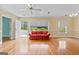 Sun-filled open-plan living room with gleaming hardwood floors and plenty of space to relax at 441 Crumbley Rd, Mcdonough, GA 30252