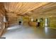 Spacious living room features wood-paneled walls, brick fireplace and built-in bar at 441 Crumbley Rd, Mcdonough, GA 30252
