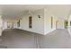 Spacious outdoor porch with grey floors and a ceiling fan at 441 Crumbley Rd, Mcdonough, GA 30252