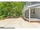 Beautiful backyard featuring a spacious patio with grill and comfortable porch swing at 441 Crumbley Rd, Mcdonough, GA 30252
