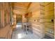 Cozy room boasts wood-paneled walls, desk, chair and doorway at 441 Crumbley Rd, Mcdonough, GA 30252