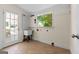 Mud room with a utility sink, window and door at 441 Crumbley Rd, Mcdonough, GA 30252
