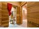 Unique room with wooden walls, payphone booth and doorway to adjacent room at 441 Crumbley Rd, Mcdonough, GA 30252