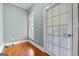 Bright room with hardwood floors, window, and a door at 441 Crumbley Rd, Mcdonough, GA 30252