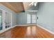 Bright room with hardwood floors, vaulted ceiling, and french doors at 441 Crumbley Rd, Mcdonough, GA 30252