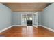 Bright room with hardwood floors and french doors leading to the outdoor space at 441 Crumbley Rd, Mcdonough, GA 30252