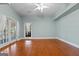 Spacious room with hardwood floors, ceiling fan, and a back door at 441 Crumbley Rd, Mcdonough, GA 30252