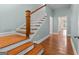 Wooden staircase leading to the upper level of the home at 441 Crumbley Rd, Mcdonough, GA 30252
