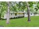 Charming single-story home features a welcoming front porch, fresh lawn and tidy landscaping at 6236 Shallow Creek Ln, Douglasville, GA 30135