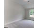 Bedroom featuring a window and carpeted floors at 3292 Mill Forest Sw Dr, Conyers, GA 30094