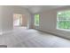 Bedroom with windows bringing in lots of natural light and an adjoining room at 3292 Mill Forest Sw Dr, Conyers, GA 30094