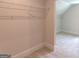 Walk in closet featuring wire rack shelving and carpeted floor at 3292 Mill Forest Sw Dr, Conyers, GA 30094