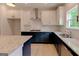 Attractive kitchen boasting granite countertops, stainless steel appliances, and modern fixtures at 3292 Mill Forest Sw Dr, Conyers, GA 30094