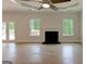 Inviting living room with fireplace, hardwood floors, and direct access to the outdoor patio at 3292 Mill Forest Sw Dr, Conyers, GA 30094