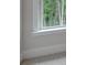 White trimmed window overlooking trees and nature, with light carpet and white trim at 3292 Mill Forest Sw Dr, Conyers, GA 30094