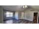 Spacious bedroom with hardwood floors and large windows, offering ample natural light at 1230 Chris Lake Dr, Lawrenceville, GA 30046