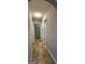 Hallway showing access to multiple rooms and featuring tiled floors at 1230 Chris Lake Dr, Lawrenceville, GA 30046
