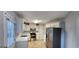Well-lit kitchen with white cabinets, stainless steel appliances, and easy access to the outside at 1230 Chris Lake Dr, Lawrenceville, GA 30046