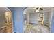 Open-concept living space features neutral paint, tile floors, and arched doorways that add architectural interest at 1230 Chris Lake Dr, Lawrenceville, GA 30046