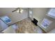 Bright living area features tall windows, a fireplace, neutral paint, and stylish tile flooring at 1230 Chris Lake Dr, Lawrenceville, GA 30046