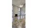 Bright living area features tall windows, a fireplace, neutral paint, and stylish tile flooring at 1230 Chris Lake Dr, Lawrenceville, GA 30046