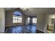 Spacious living room with large windows, vaulted ceiling, and plenty of natural light at 1230 Chris Lake Dr, Lawrenceville, GA 30046