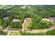 A beautiful home surrounded by lush greenery and mature trees in a serene neighborhood at 155 Grace Hope Dr, Brooks, GA 30205
