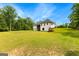 Expansive backyard with lush green lawn, complementing the home's exterior and private setting at 155 Grace Hope Dr, Brooks, GA 30205