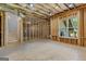 Unfinished basement space with framed walls, ductwork, and a window, ready to be customized at 155 Grace Hope Dr, Brooks, GA 30205