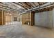 Large unfinished basement featuring exposed ceiling, concrete floor, and framed walls, ready to be transformed at 155 Grace Hope Dr, Brooks, GA 30205