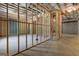 Spacious unfinished basement with exposed ceiling and framed walls, offering potential for customization at 155 Grace Hope Dr, Brooks, GA 30205