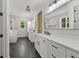 Bright primary bathroom features dual vanities, tiled floors, and a walk-in shower at 155 Grace Hope Dr, Brooks, GA 30205