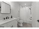 Bathroom featuring white vanity with marble countertop, black hardware, mirror, and shower at 155 Grace Hope Dr, Brooks, GA 30205