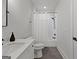Bathroom featuring a tiled tub/shower, white vanity, marble countertop, and black hardware at 155 Grace Hope Dr, Brooks, GA 30205