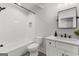 Updated white bathroom features modern fixtures, including a black framed mirror and subway tile shower at 155 Grace Hope Dr, Brooks, GA 30205