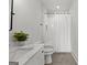 Bathroom featuring white vanity, marble countertop, and tiled tub/shower with black hardware at 155 Grace Hope Dr, Brooks, GA 30205