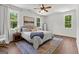 Bedroom with a large window, ceiling fan, and primary suite bathroom access at 155 Grace Hope Dr, Brooks, GA 30205
