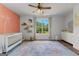 Bright Bedroom featuring a crib, area rug, and a window with views to the outdoors at 155 Grace Hope Dr, Brooks, GA 30205
